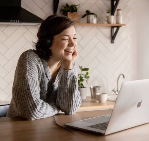 Woman sitting before her laptop